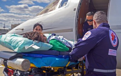 Pediatric critical care flight team preparing a fixed-wing air ambulance transport