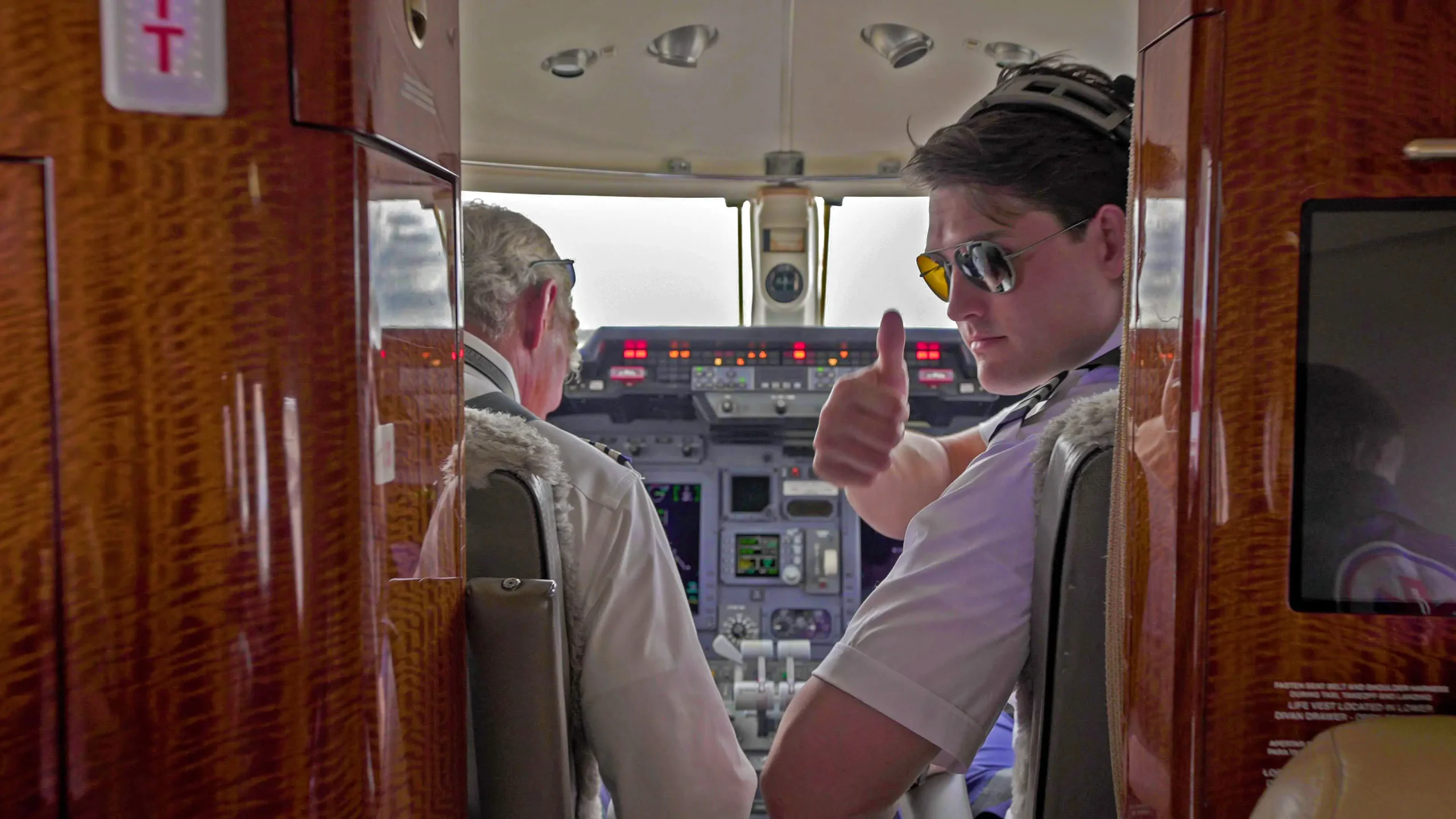 Air Medical Transport flight crew giving a thumbs-up before departure